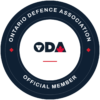 A circular badge denoting membership in the Ontario Defence Association
